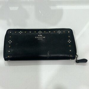 Black Coach wallet with pretty detailing